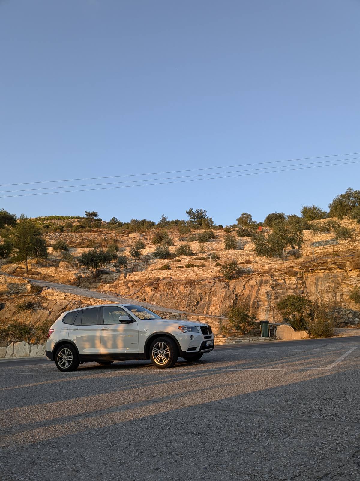 The X3 on a Thassos coastal road at sunset