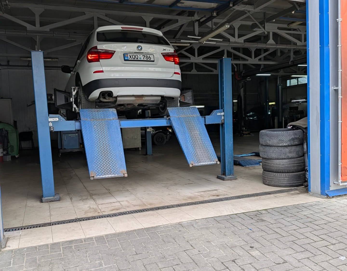 The X3 on the lift in the workshop