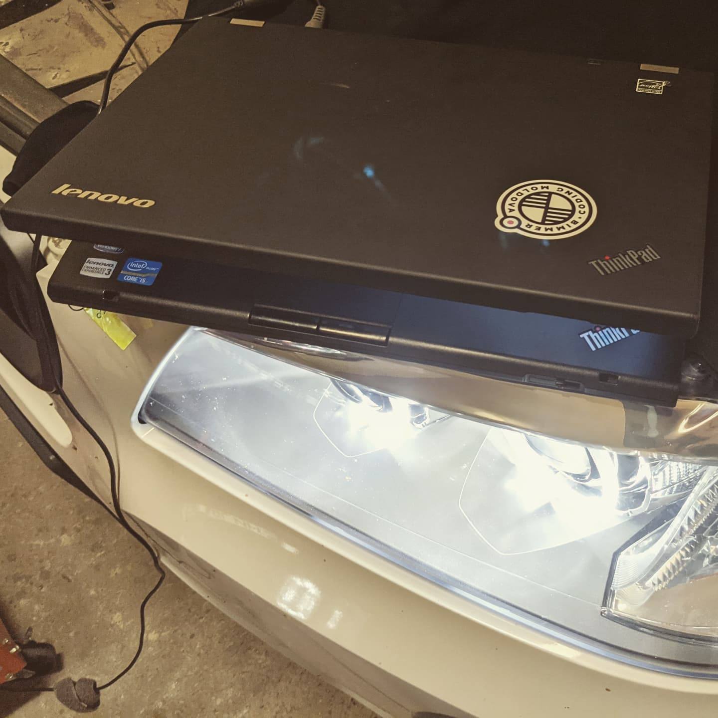 The coding laptop on the bonnet