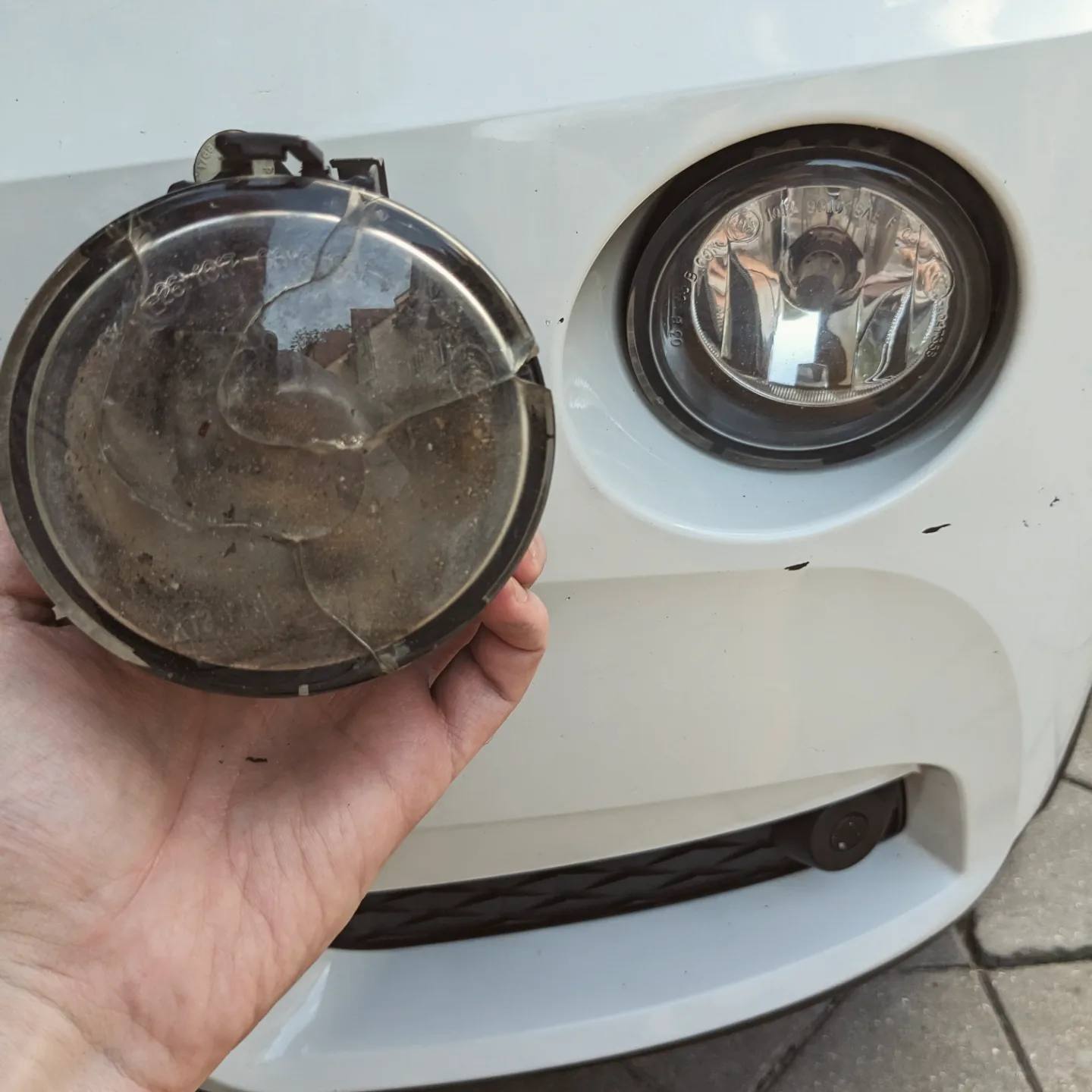 The old fog light, held in hand