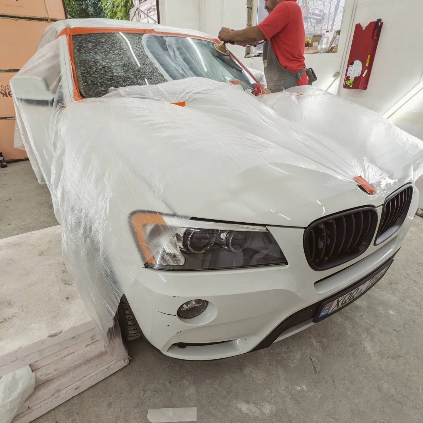 The car wrapped in film for the windshield polish