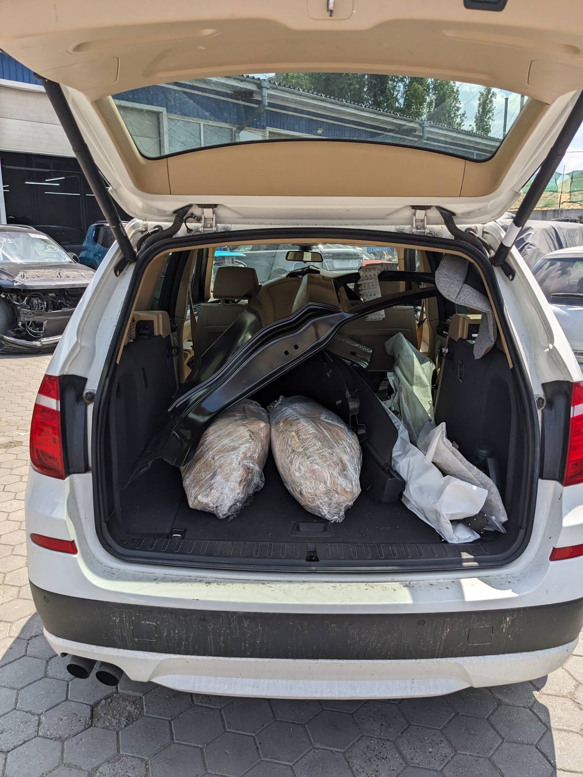 The X3 boot full of parts for the M240i