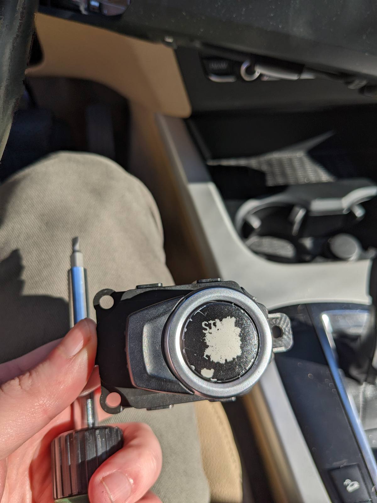 The start button removed, held in hand