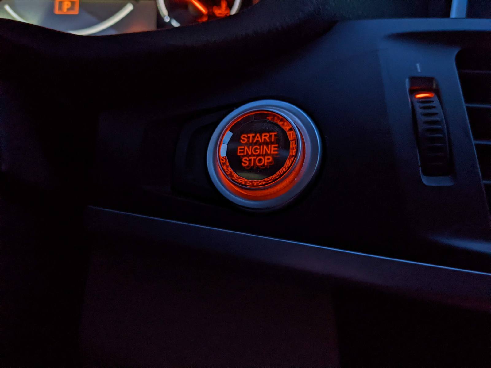 The red start button fitted and lit