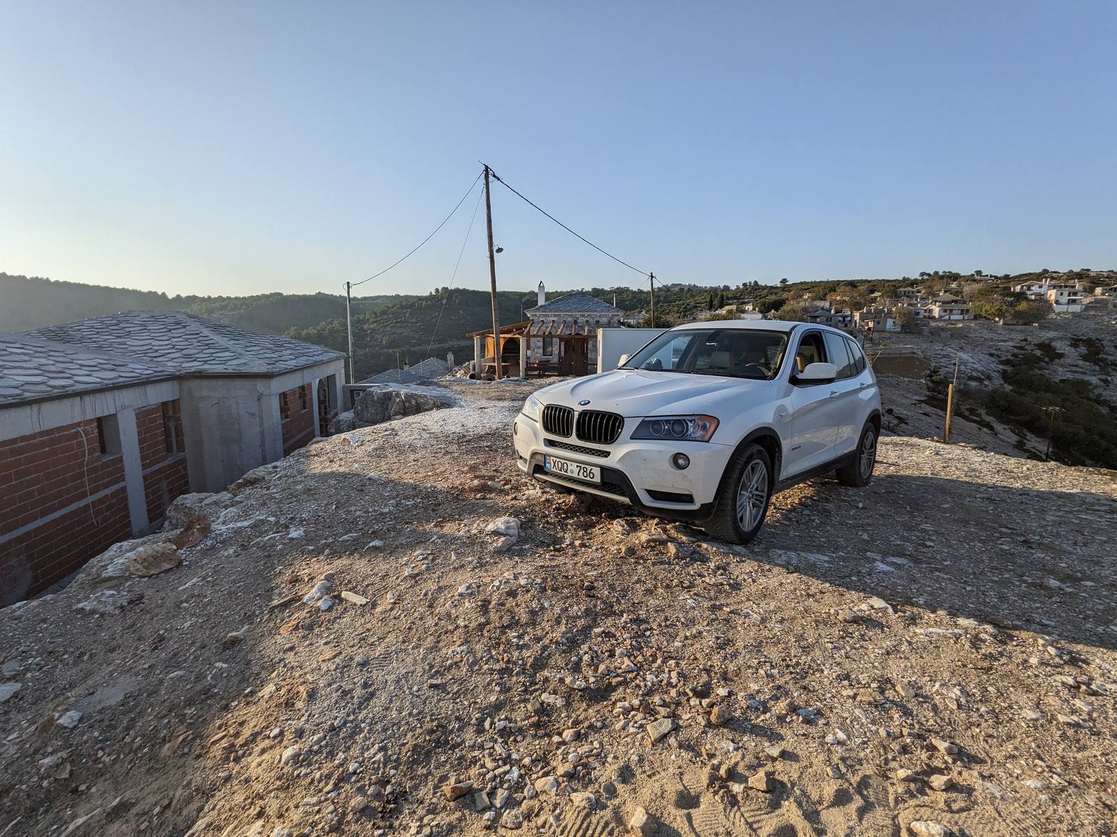 The X3 on a Thassos hill above a stone village